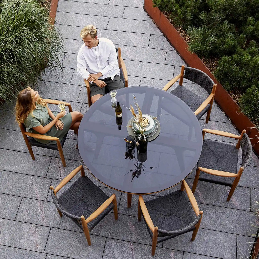 ASPECT - Round Outdoor Dining Table in Black Glass - Cane-Line | Milola