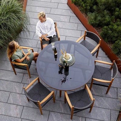 ASPECT - Round Outdoor Dining Table in Black Glass - Cane-Line | Milola