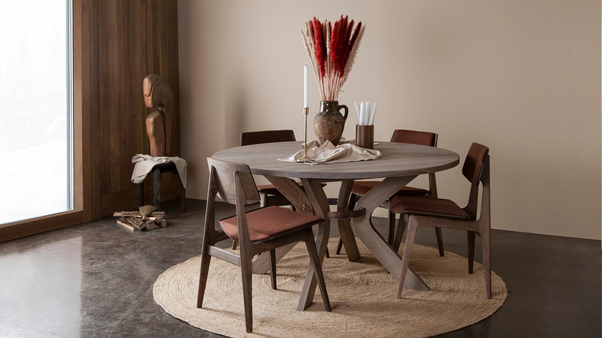 Round dining table with 4 dark red chairs