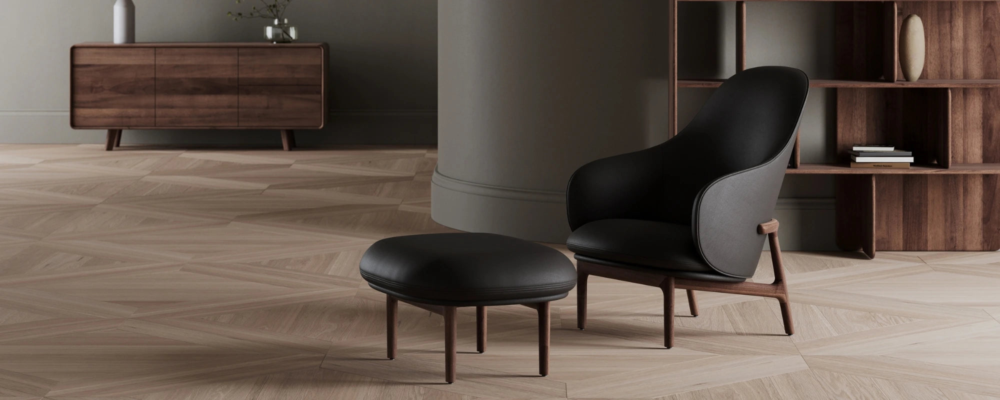 Black leather armchair with matching footstool