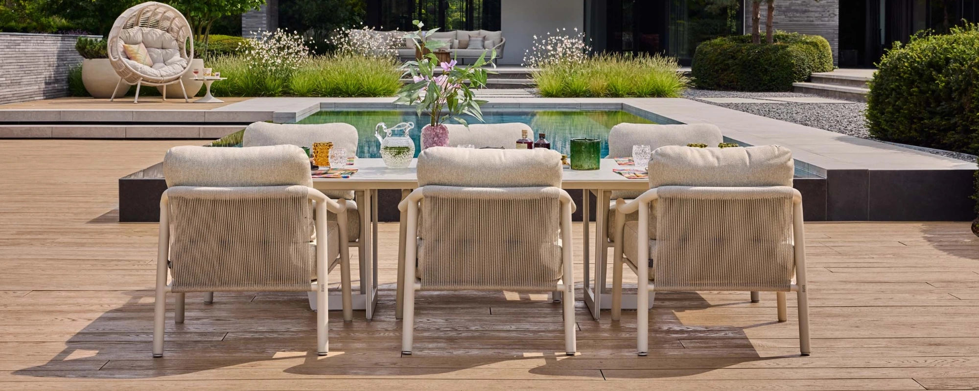 Garden with Pool showing Low Outdoor Dining Table and Chairs set